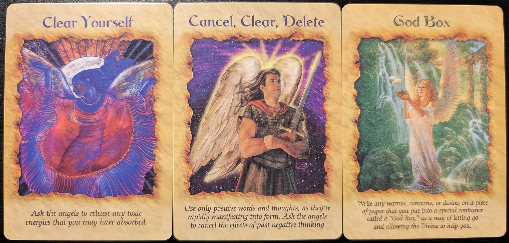 3 cards from the Angel Therapy oracle cards of Clear Yourself, Cancel, Clear, Delete, and God Box.