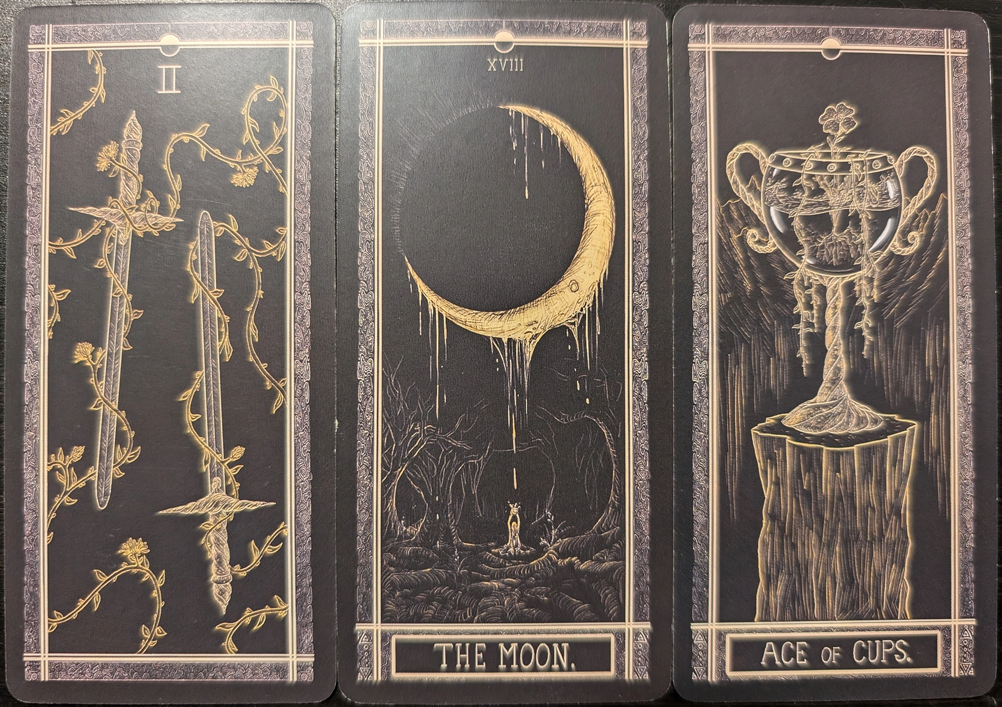 3 cards from The Kinner Tarot - Two of Swords, The Moon, Ace of Cups. 