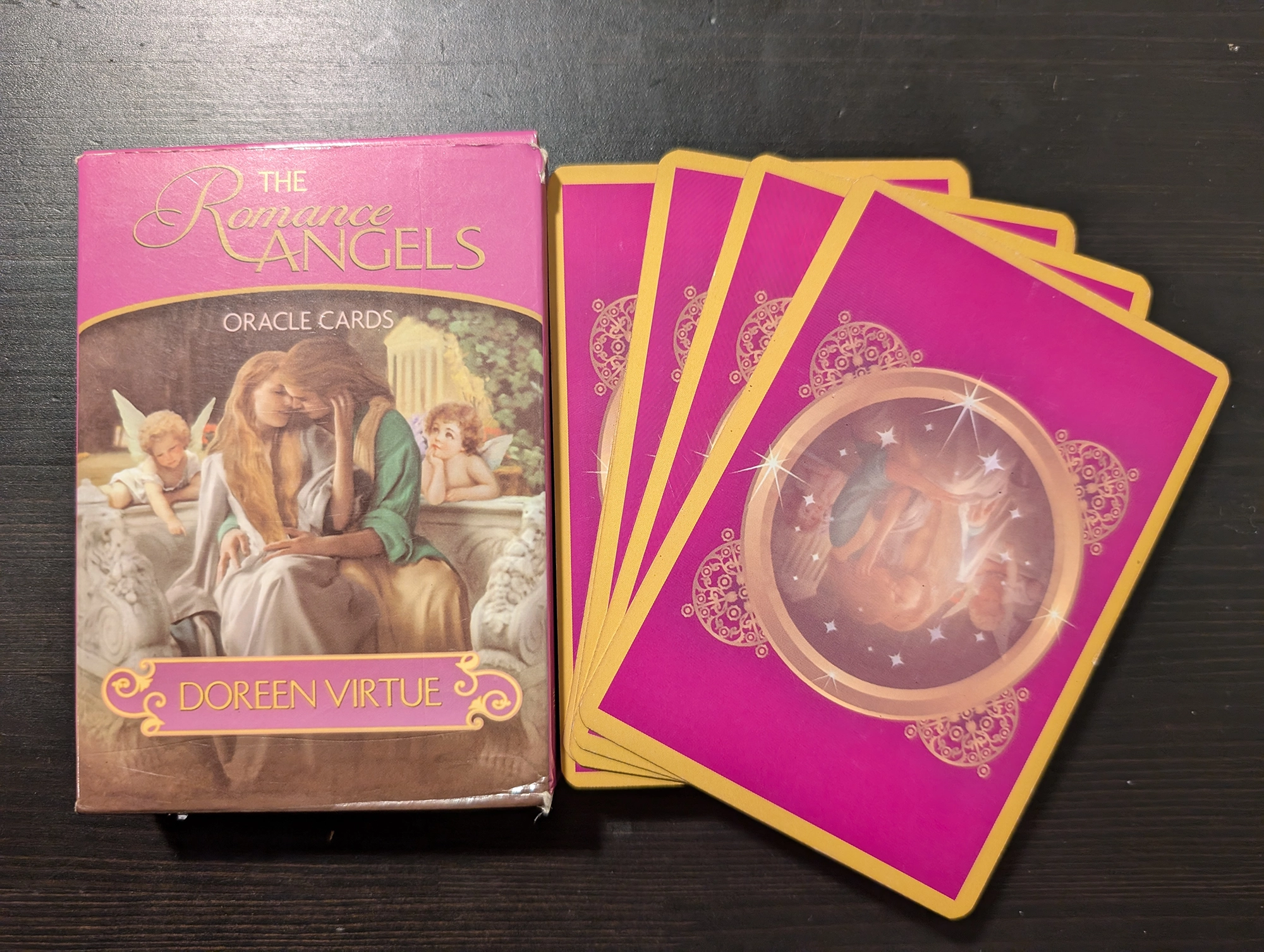 The Romance Angels box and back of deck stack