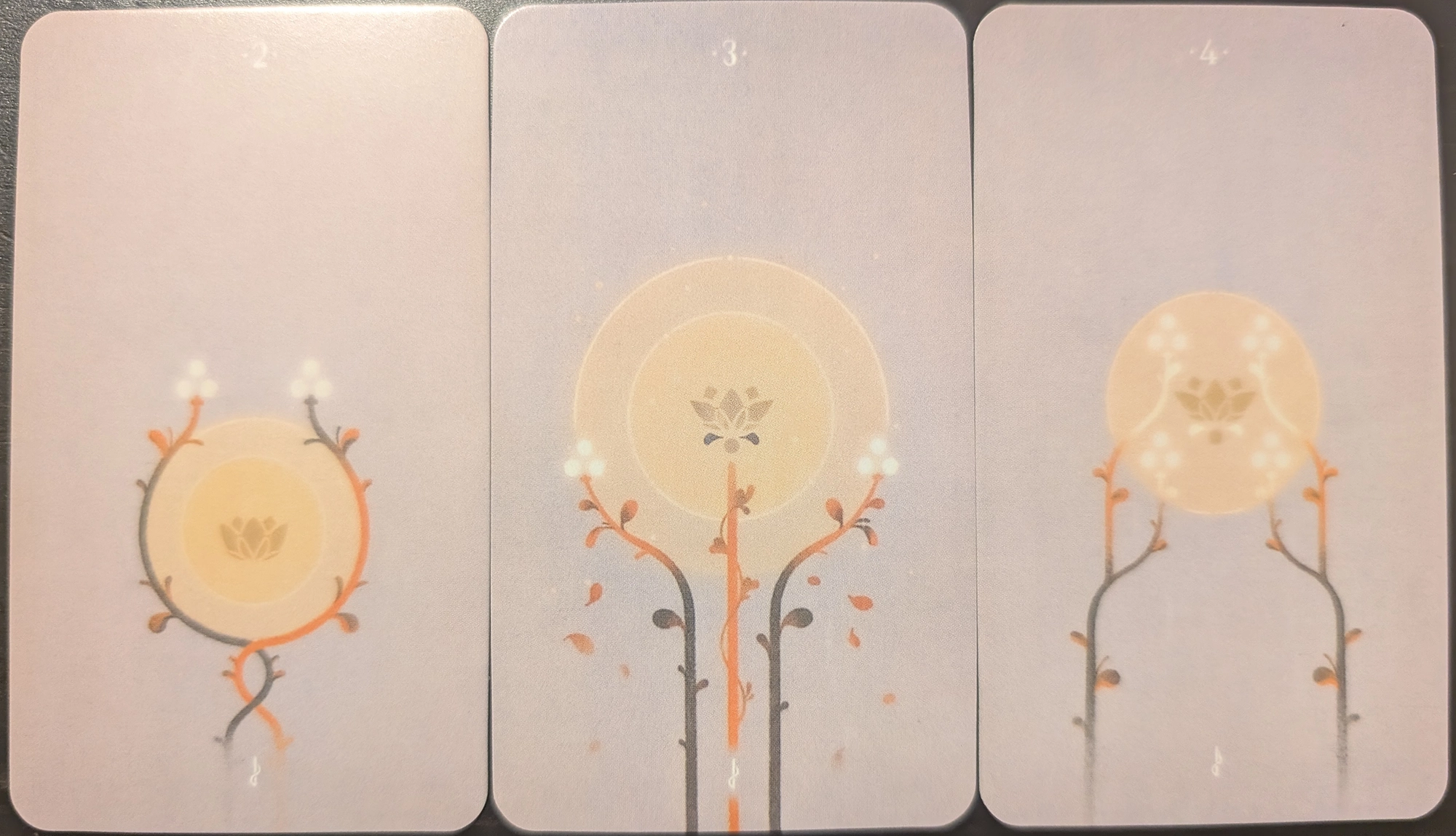 3 cards from The Spheres of Heaven tarot of the two, three, and four of wands. 