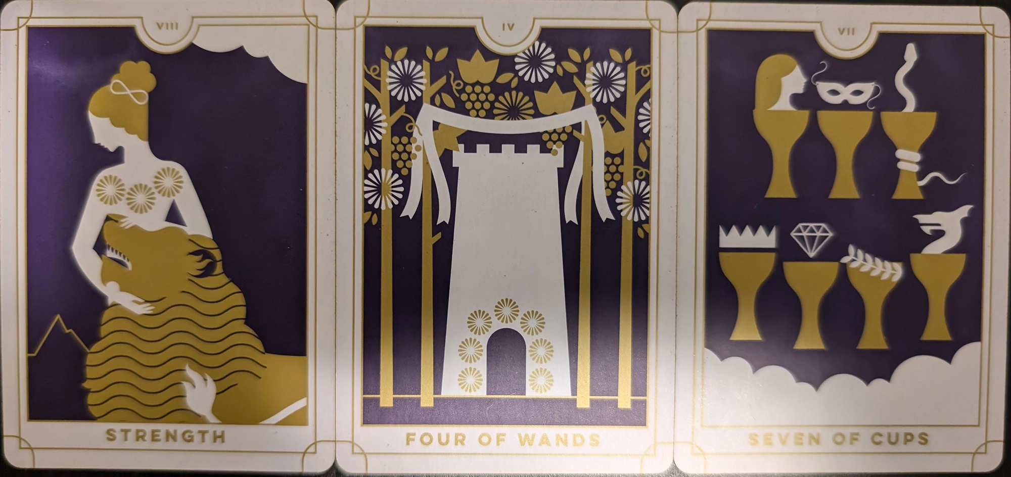 3 cards from the EVeryday Tarot of Strength, Four of Wands, Seven of Cups