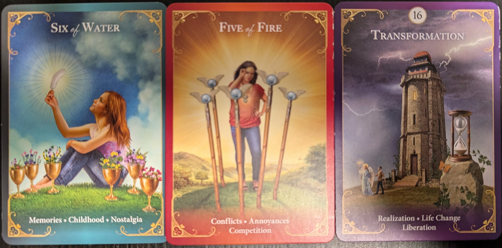 3 cards from the Guardian Angel Messages Tarot of Six of Water, Five of Fire, and Trasnformation