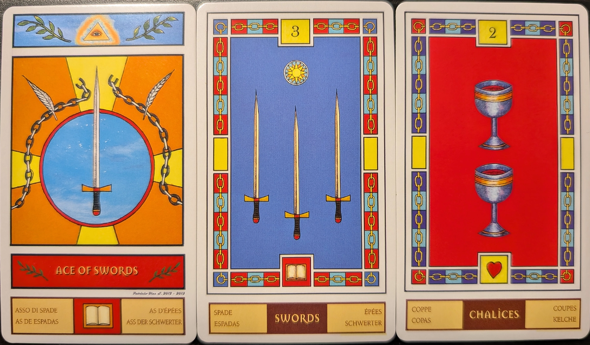 3 cards from the Masonic Tarot of the Ace of Swords, Three of Swords, and the Two of Chalices.