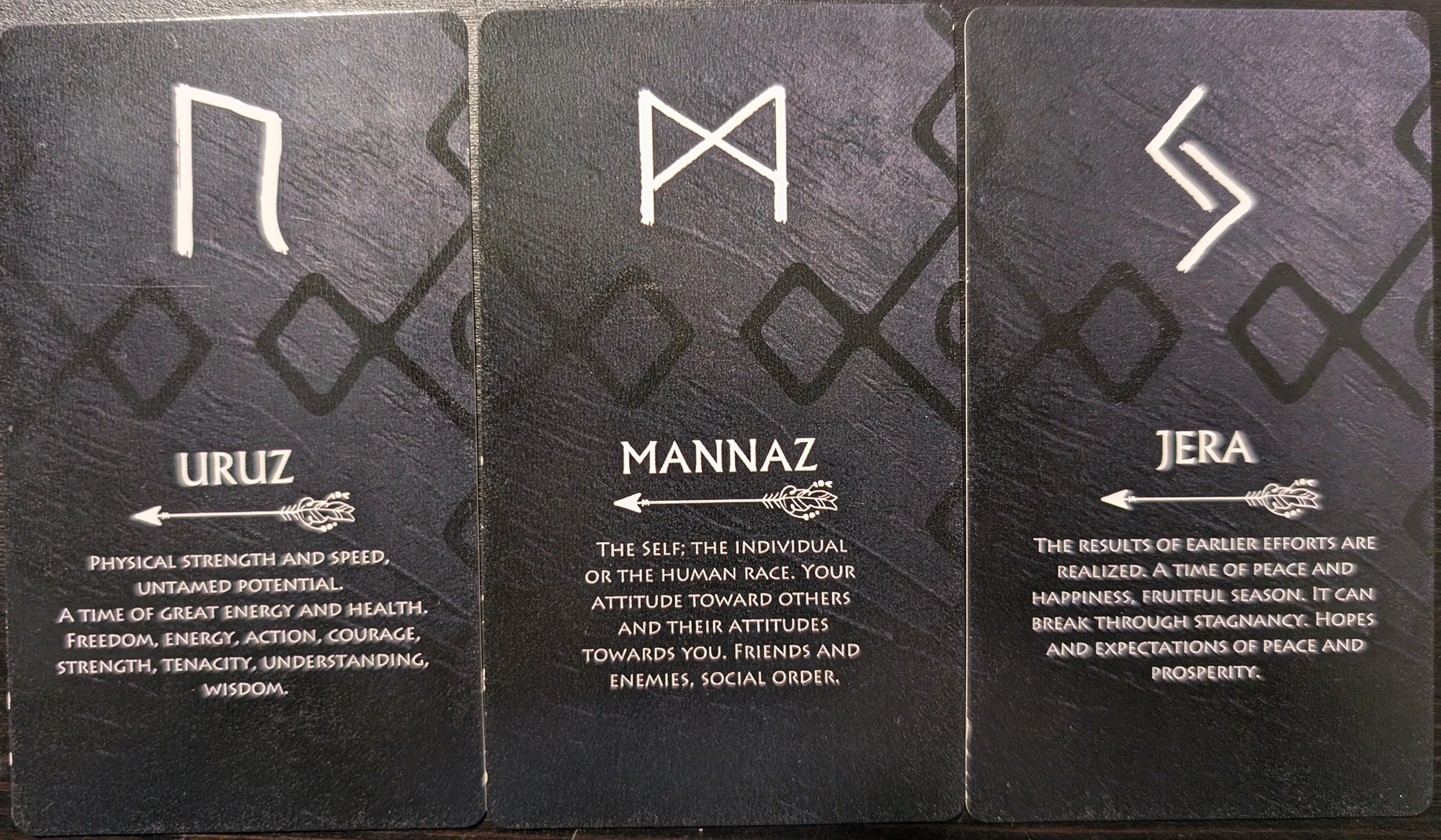 3 cards from the Runes Oracle of Uruz, Mannaz, and Jera.