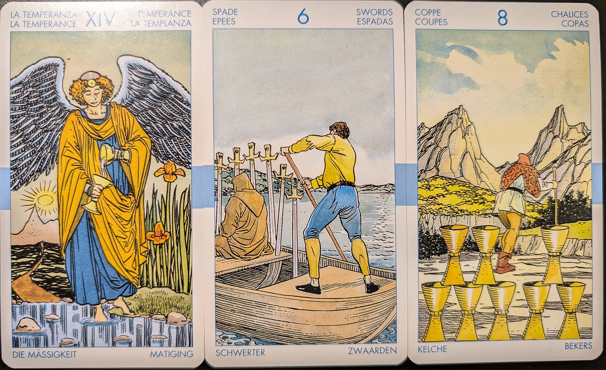 3 cards from the Universal Tarot deck of Temperance, Six of Swords, and Eight of Cups