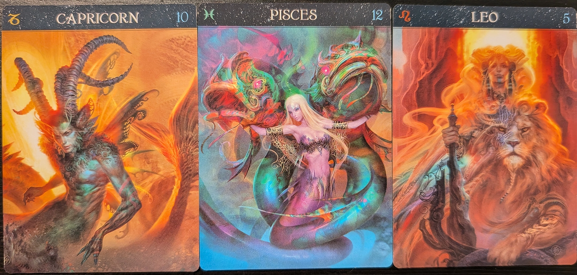 r cards from the Barbieri Zodiac Oracle of Capricorn, Pisces, and Leo. 